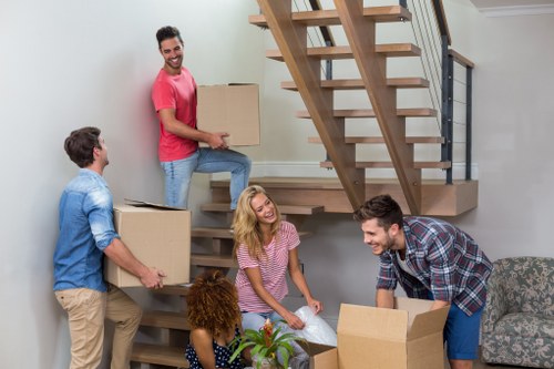 Removal team preparing household items for a move in South Kensington