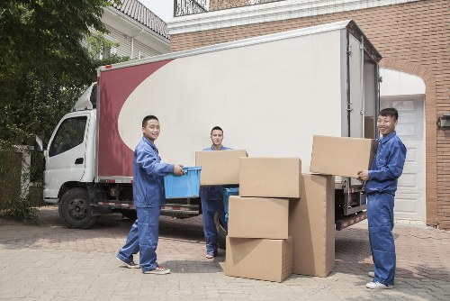Flat removals team handling furniture in South Kensington apartment building