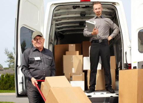 Man and van team preparing items safely before loading