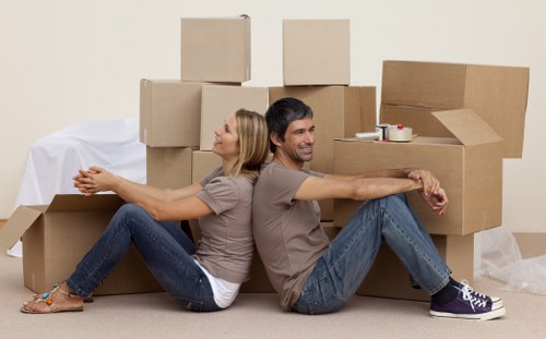 Local removal team planning a move in South Kensington with boxes and furniture