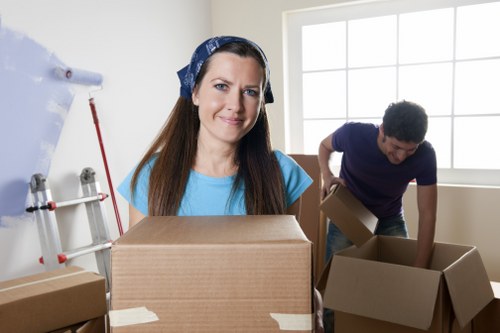 Removal van and movers loading items for a quick South Kensington relocation