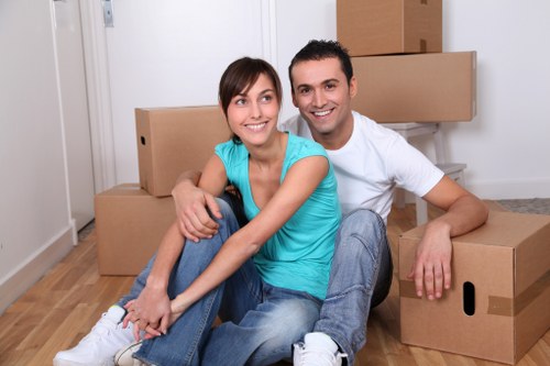 Removal workers assessing access and handling risks